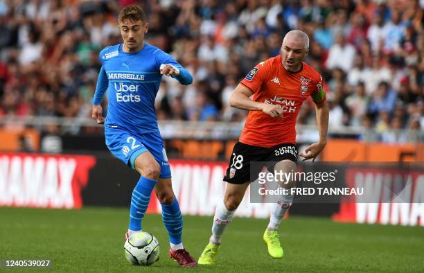 Lorient's French midfielder Fabien Lemoine fights for the ball with Marseille's French midfielder Valentin Rongier L) during the French L1 football...