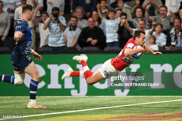 Racing92's Argentinian wing Juan Imhoff dives to score a try during the European Rugby Champions Cup rugby union Quarter-Final match between Racing92...