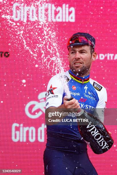 Team Quick-Step Alpha Vinyl's British rider Mark Cavendish celebrates on the podium after winning the third stage of the Giro d'Italia 2022 cycling...