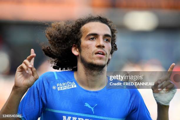 Marseille's French midfielder Matteo Guendouzi celebrates after scoring a goal during the French L1 football match between Lorient and Olympique de...