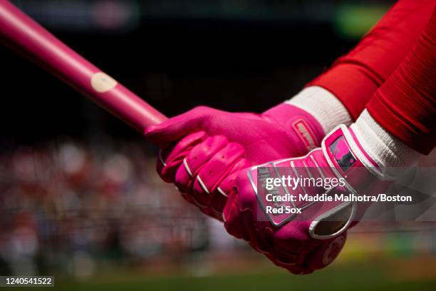 The Franklin batting gloves of Enrique Hernández of the Boston Red Sox are shown as he warms up in the on deck circle during the third inning of a...