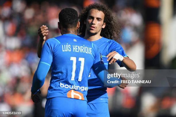 Marseille's French midfielder Matteo Guendouzi and Marseille's Brazilian forward Luis Henrique celebrate at the end of the L1 football match between...