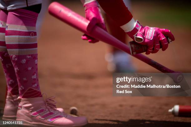 The Franklin batting gloves of Enrique Hernández of the Boston Red Sox are shown as he warms up in the on deck circle during the third inning of a...