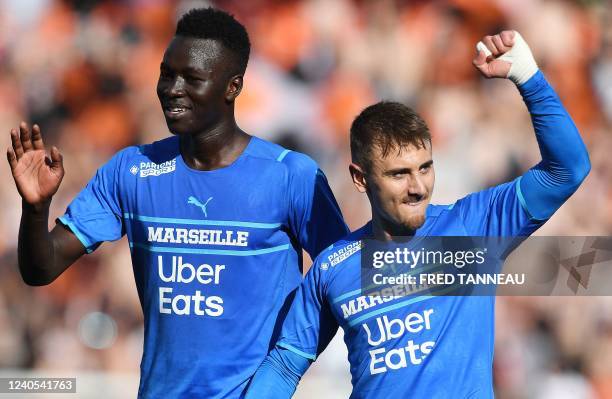Marseille's French defender Jordan Amavi and Marseille's French midfielder Valentin Rongier celebrate at the end of the L1 football match between...