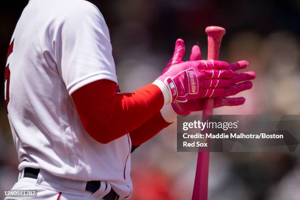 The Franklin batting gloves of Enrique Hernández of the Boston Red Sox are shown as he warms up in the on deck circle during the third inning of a...