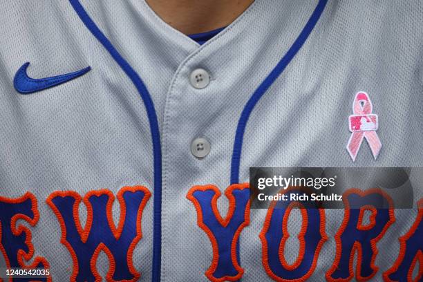 Brandon Nimmo of the New York Mets wears a pink ribbon in honor of Mothers Day during game one of a double header against the Philadelphia Phillies...