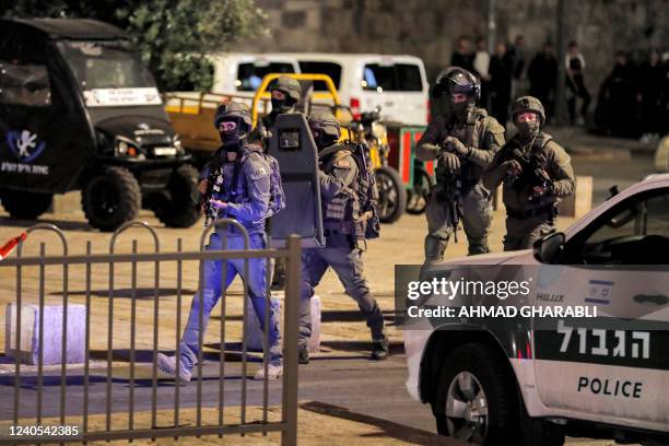 Members of the Yamas special forces counter-terrorism unit, attached to the Israeli border guards, patrol at the scene of a stabbing attack at the...