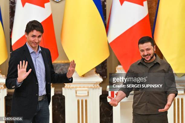 Ukrainian President Volodymyr Zelensky and Canada's Prime Minister Justin Trudeau gestures during a joint press conference in Kyiv on May 8, 2022...