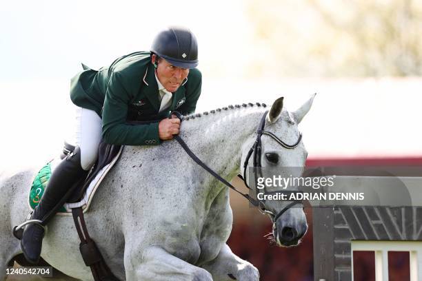 Ireland's Austin O'Connor riding Colorado Blue, jumps a fence during the showjumping test of the Badminton Horse Trials in Badminton, central England...