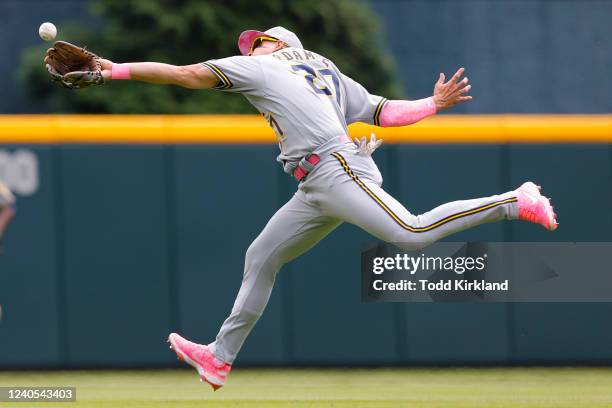 Willy Adames of the Milwaukee Brewers cant bring in the ball off the bat of Matt Olson of the Atlanta Braves during the second inning at Truist Park...