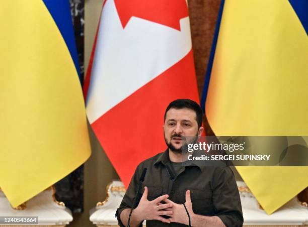 Ukrainian President Volodymyr Zelensky gestures during a joint press conference with Canada's Prime Minister Justin Trudeau in Kyiv on May 8 amid the...