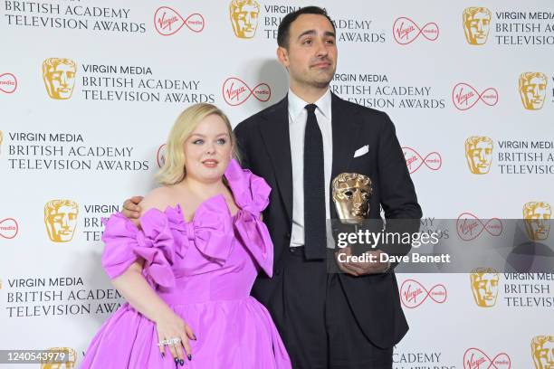 Nicola Coughlan and Jamie Demetriou, winner of the Male Performance In A Comedy award for "Stath Lets Flats", pose in the winner's room at the Virgin...