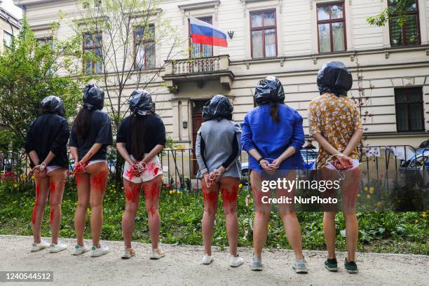 Ukrainian and Polish women attend 'Rape Is a War Crime' protest in front of the Consulate General of Russia in Krakow, Poland on May 8th, 2022. A day...