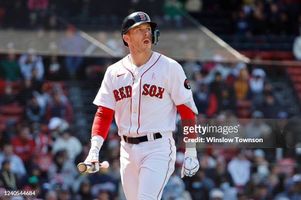 Trevor Story of the Boston Red Sox heads back to the dugout after striking out against the Chicago White Sox during the eighth inning at Fenway Park...