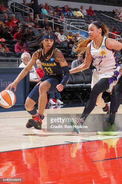 Destanni Henderson of the Indiana Fever drives to the basket against the Los Angeles Sparks on May 8, 2022 at Bankers Life Fieldhouse in...