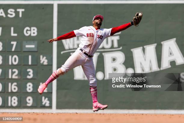 Xander Bogaerts of the Boston Red Sox snares a line drive off the bat of Danny Mendick of the Chicago White Sox during the seventh inning at Fenway...