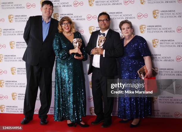 Mark Labbett, Jenny Ryan, Paul Sinha and Anne Hegerty with the Daytime award for "The Chase" pose in the winners room at the Virgin Media British...