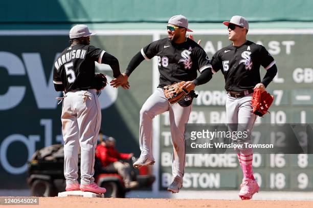 Leury Garcia of the Chicago White Sox congratulates Josh Harrison after they defeated the Boston Red Sox at Fenway Park on May 8, 2022 in Boston,...