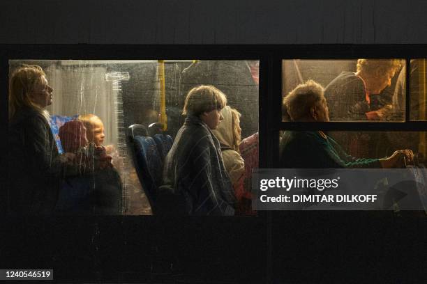 People evacuated from Mariupol arrive on buses at a registration and processing area for internally displaced people in Zaporizhzhia, on May 8, 2022....