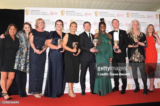 Dermot O'Leary and Clara Amfo pose with winners of the Live Event Award for The Earthshot Prize 2021 in the winner's room at the Virgin Media British...