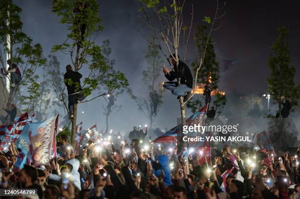 Trabzonspor supporters celebrate after winning the Turkish Super Lig championship football title, in Istanbul, on May 8, 2022. - Trabzonspor won the...