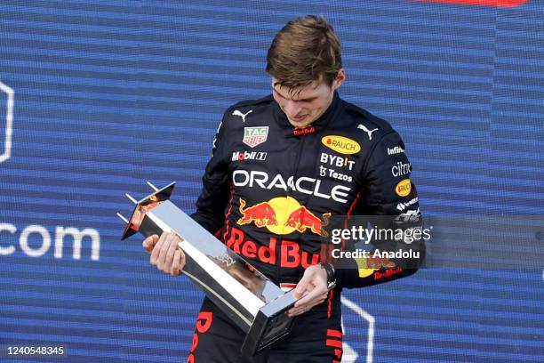 Belgian-Dutch driver Max Verstappen of Red Bull Racing receives a trophy on the podium after winning the Formula One Grand Prix of Miami at the Miami...