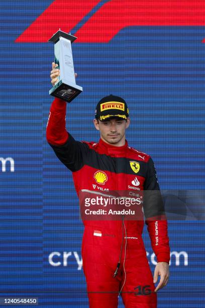 Monegasque driver Charles Leclerc of Scuderia Ferrari celebrates on the podium after arriving in second place during the Formula One Grand Prix of...