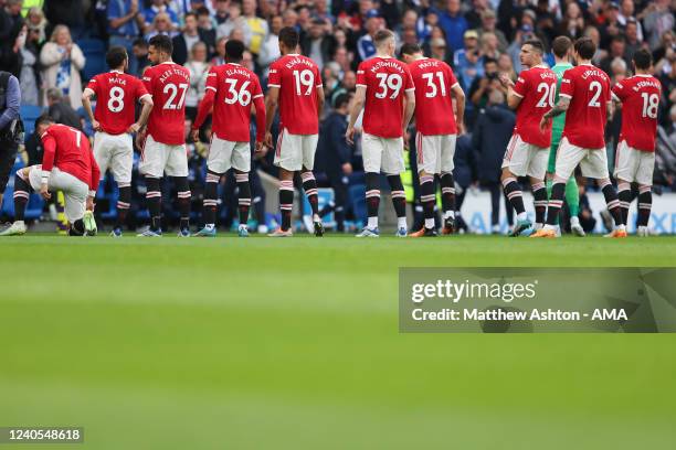 Team line up of Manchester United showing numbers on the back of their shirts with Cristiano Ronaldo on his knees during the Premier League match...