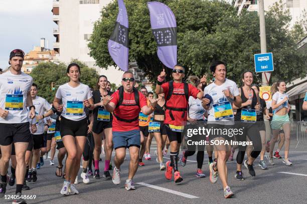 Runners seen on a street of the marathon route next to the stadium of Barcelona Football Club during the Barcelona marathon. Barcelona marathon was...