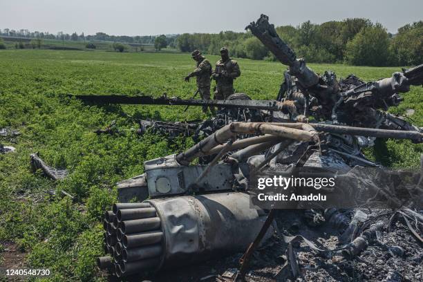 Ukrainian soldiers in a downed Russian helicopter in the outskirts of Kharkiv, Ukraine, 8 May 2022