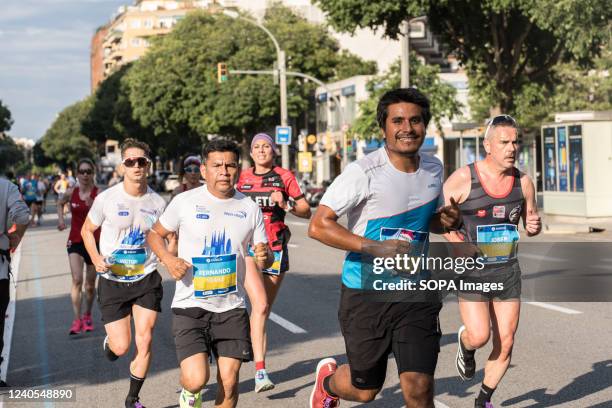 Runners seen on a street of the marathon route next to the stadium of Barcelona Football Club during the Barcelona marathon. Barcelona marathon was...