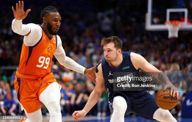 Luka Doncic of the Dallas Mavericks handles the ball as Jae Crowder of the Phoenix Suns defends during the second half of Game Four of the 2022 NBA...