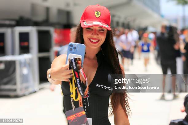 Ferrari fan takes a selfie prior to the first running of the Crypto.com Miami Grand Prix on May 8, 2022 at the Miami International Autodrome in Miami...