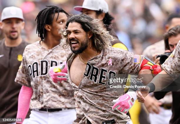Jorge Alfaro of the San Diego Padres celebrates after hitting a three-run walk-off home run during the ninth inning of a baseball game against the...
