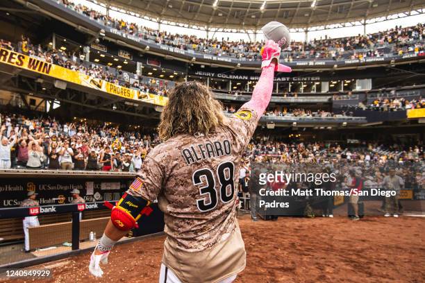 Jorge Alfaro of the San Diego Padres waves to the crowd after hitting a walk off home run in the ninth inning against the Miami Marlins on May 8,...
