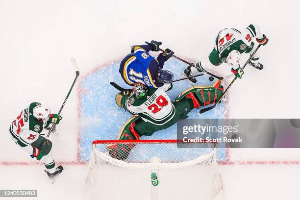 May 8: Jonas Brodin Jared Spurgeon and Marc-Andre Fleury of the Minnesota Wild defend the net against Robert Thomas of the St. Louis Blues in Game...