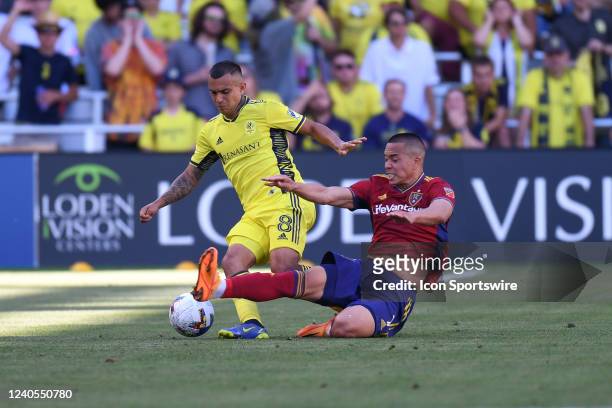 Real Salt Lake forward Bobby Wood attempts a slide tackle on Nashville SC midfielder Randall Leal during the MLS match between Real Salt Lake and...