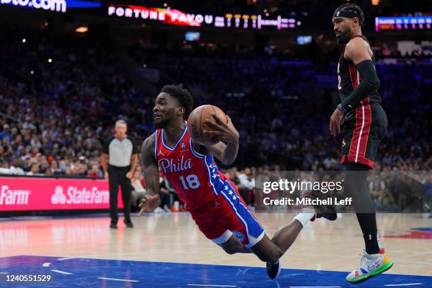 Shake Milton of the Philadelphia 76ers drives to the basket and is fouled by Gabe Vincent of the Miami Heat in the first half during Game Four of the...