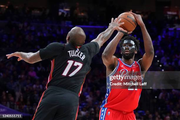 Joel Embiid of the Philadelphia 76ers shoots the ball against P.J. Tucker of the Miami Heat in the first half during Game Four of the 2022 NBA...