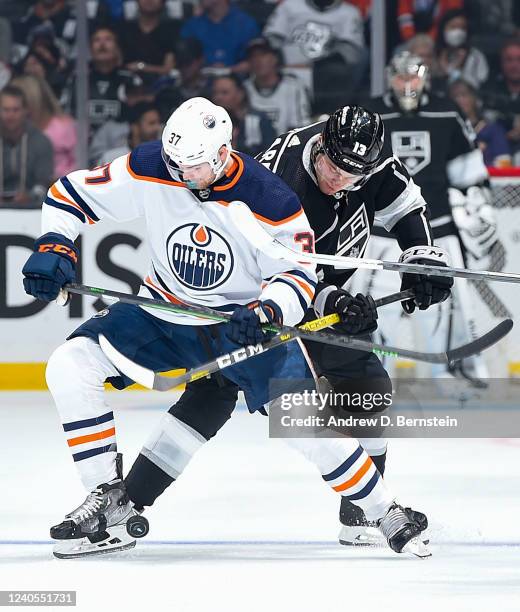 Warren Foegele of the Edmonton Oilers and Gabriel Vilardi of the Los Angeles Kings battle for position during Game Four of the First Round of the...