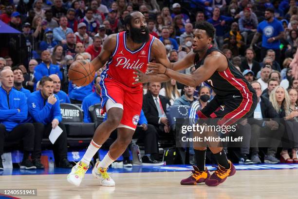 James Harden of the Philadelphia 76ers dribbles the ball against Kyle Lowry of the Miami Heat in the first half during Game Four of the 2022 NBA...