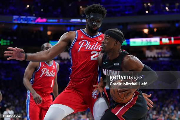 Jimmy Butler of the Miami Heat drives to the basket against Joel Embiid of the Philadelphia 76ers in the second half during Game Four of the 2022 NBA...