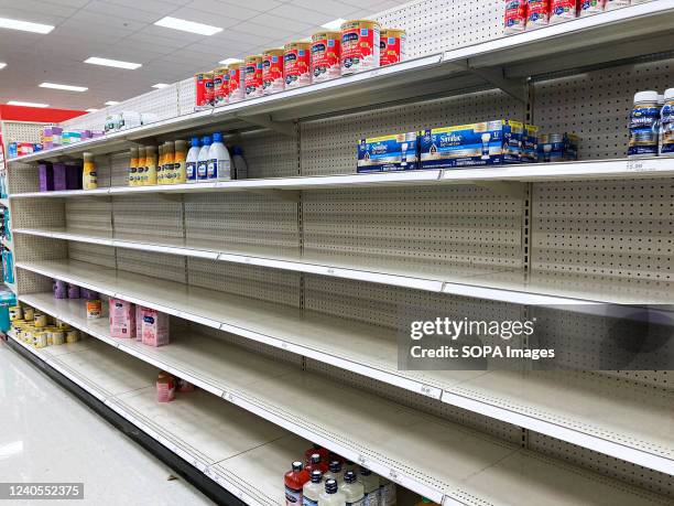 Nearly empty baby formula display shelf is seen at a Target store in Orlando. Stores across the United States have struggled to stock enough baby...