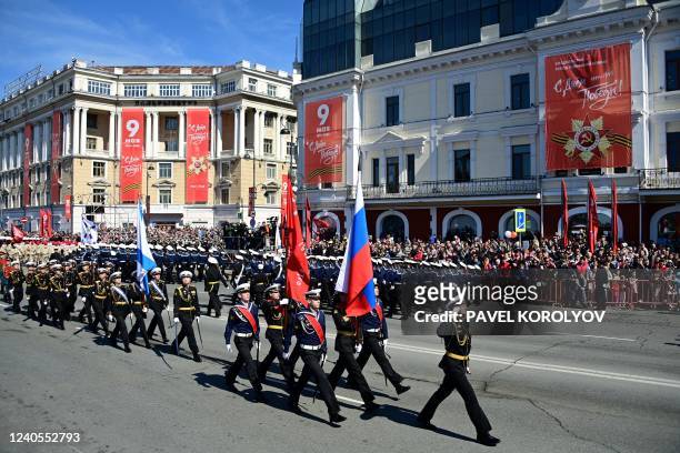 Servicemen take part in a military parade, which marks the 77th anniversary of the Soviet victory over Nazi Germany in World War Two, in the far...