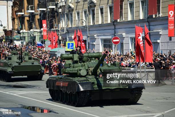 Military vehicles roll through the far eastern city of Vladivostok during a military parade, which marks the 77th anniversary of the Soviet victory...