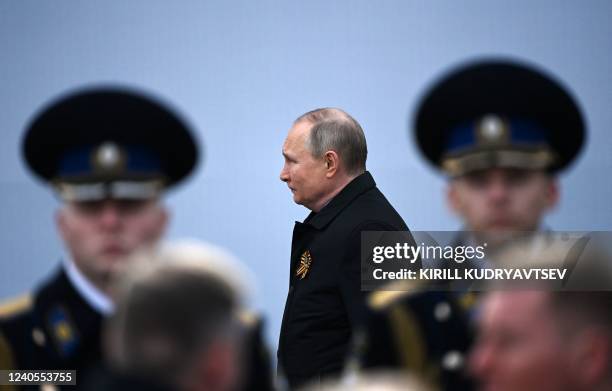 Russian President Vladimir Putin arrives to watch the Victory Day military parade at Red Square in central Moscow on May 9, 2022. - Russia celebrates...