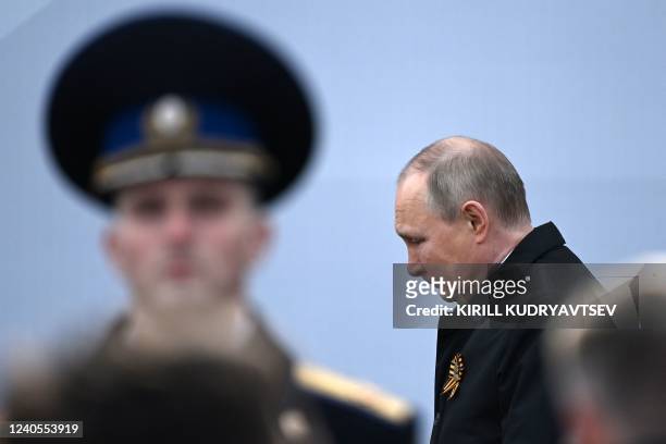 Russian President Vladimir Putin arrives to watch the Victory Day military parade at Red Square in central Moscow on May 9, 2022. - Russia celebrates...