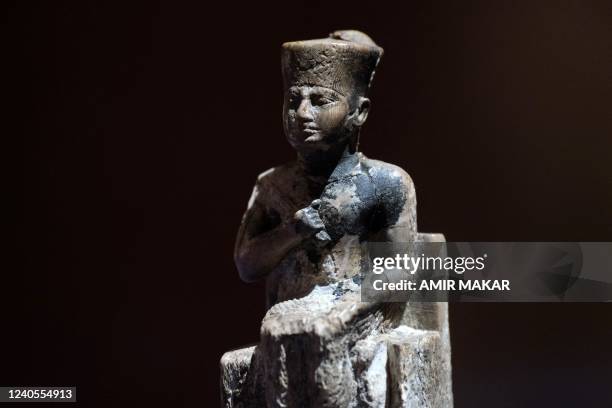 This picture taken on May 3, 2022 shows a view of the only known ivory statuette of the Ancient Egyptian Old kingdom king Khufu , builder of the...