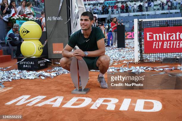 Carlos Alcaraz of Spain celebrates with the champion trophy after winning against Alexander Zverev of Germany during the Final ATP match during the...