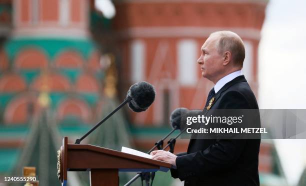 Russian President Vladimir Putin gives a speech during the Victory Day military parade at Red Square in central Moscow on May 9, 2022. Russia...